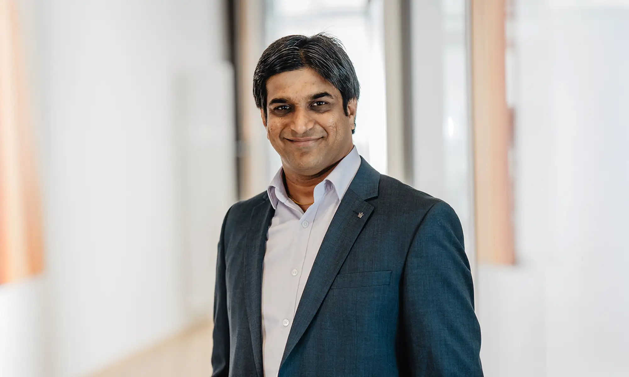 Portrait of Virendrakumar Pathak with a suit